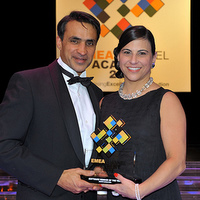 Farouk Hemraj (left), CEO at DISTREE Events, presents the Software Vendor of the Year award to Microsoft's Dana Manciagli (right)